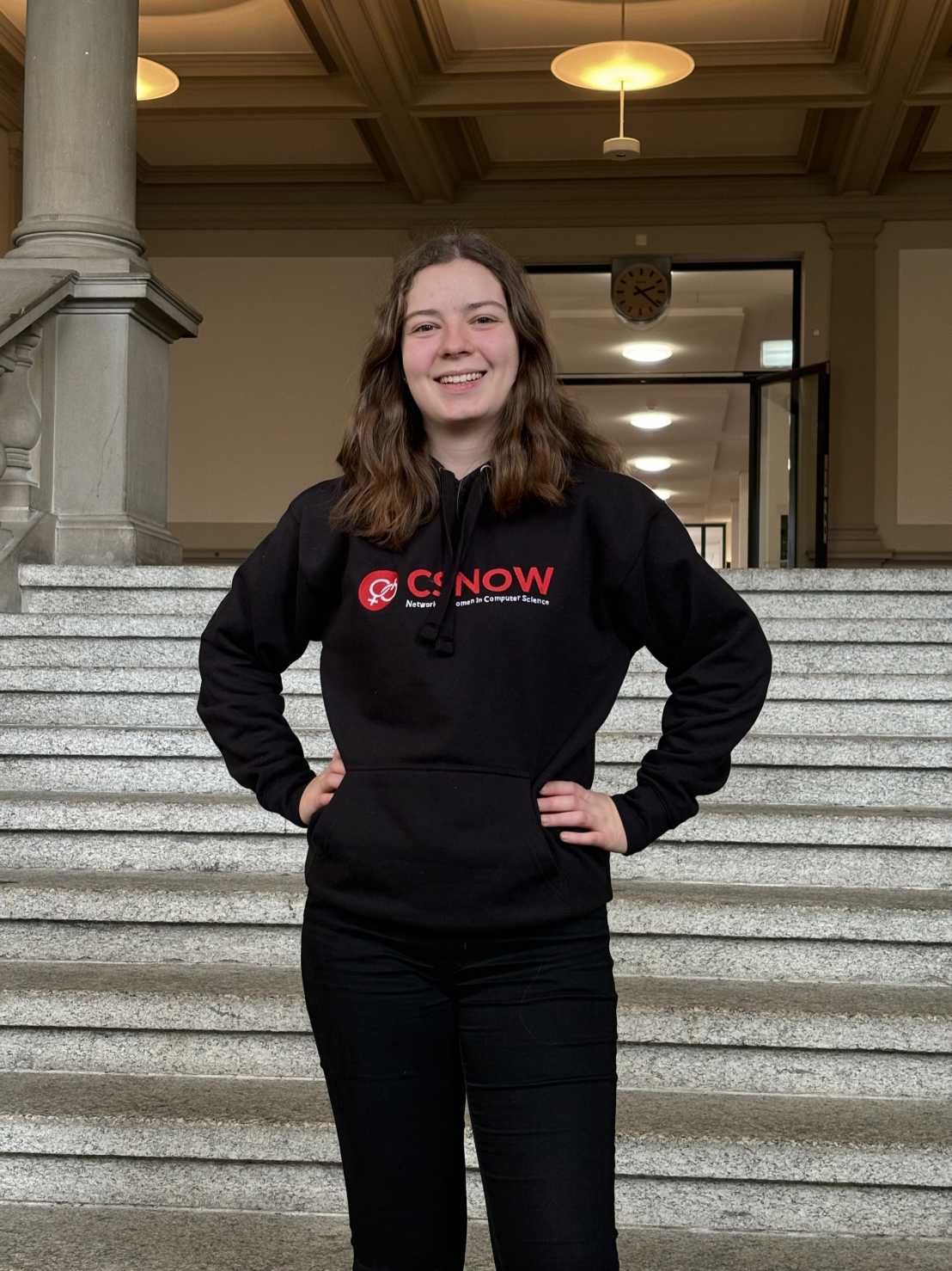 Victoria smiling with hands on hips